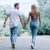 Couple walking holding handss